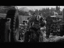 a black and white photo of a group of soldiers with a robot in the middle