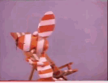 a candy stripe peppermint gum bar with a stuffed animal on top of it
