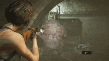 a woman is holding a gun in a video game and the number 10 is on the screen .