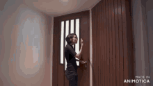 a woman is knocking on a door that is made in animotica