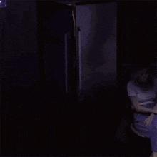 a group of people in white coats are standing in a refrigerator .