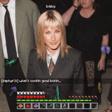 a woman in a suit and tie is standing next to a man in a suit and tie and a woman in a black dress