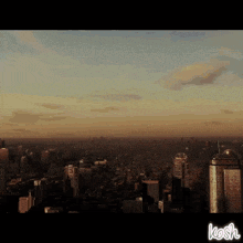 an aerial view of a city with the word kosh on the bottom left
