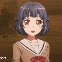 a girl in a school uniform has a red bow on her neck
