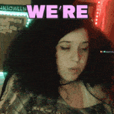 a woman says we 're in purple letters