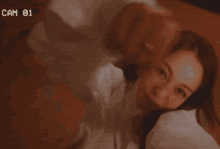 a woman taking a selfie with a cam 01 on the bottom right