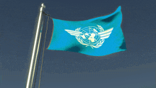a blue flag with the united nations logo on it is waving in the wind