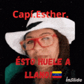 a woman wearing glasses and a white hat with the name capi.esther