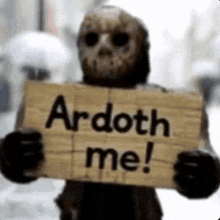 a skeleton is holding a wooden sign that says ardoth me