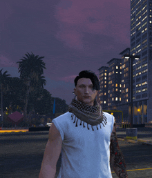 a man wearing a scarf around his neck is standing in front of a city at night