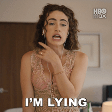 a woman wearing headphones says i 'm lying in front of a hbo max logo