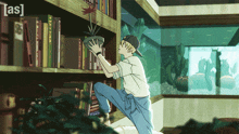 a man in a baseball cap holds a potted plant in front of a bookshelf with a fish tank in the background