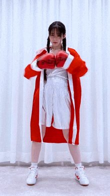 a woman wearing boxing gloves with the letters ehzizhe on them