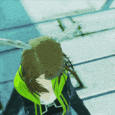 a woman wearing a yellow and black jacket with the word wow on the front