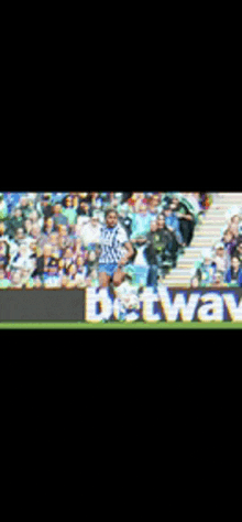a blurred image of a soccer game with a banner for betway in the foreground