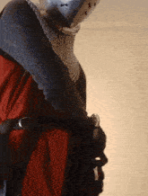 a person wearing chain mail holding a sword in their hand