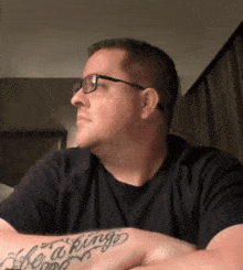a man with a tattoo on his arm that says life is a king