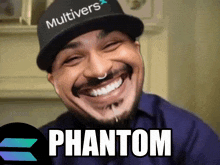 a man wearing a hat that says multivers is smiling