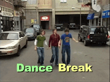 a group of young men are dancing on a street with the words dance break written above them