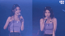 a woman singing into a microphone with the word iu in the corner