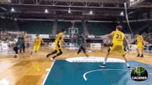 a group of basketball players are playing a game and one of them has the number 33 on their jersey