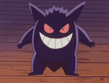 a purple monster with red eyes and a large smile on its face