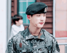 a man in a military uniform with adn written on his chest