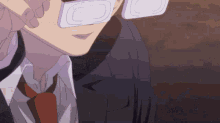 a close up of a person wearing glasses with the letter c on them