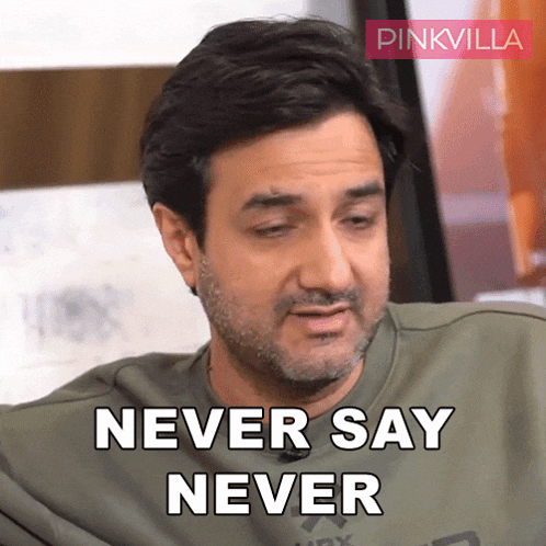 a man with a beard and a green shirt says never say never