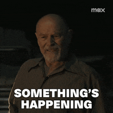 a man says something 's happening in front of a max logo