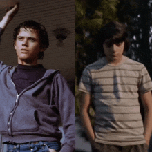 a man in a blue hoodie and a man in a striped shirt are standing next to each other