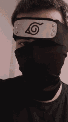 a man wearing a headband with a circle on it