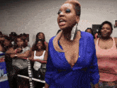 a woman in a blue shirt with everlast written on it