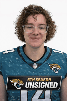 a man wearing a jaguars jersey that says 6th season unsigned on it