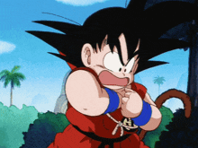 a cartoon character named goku is wearing a red and black karate uniform