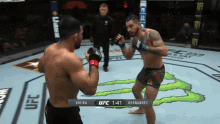 two men are fighting in a ufc ring with a monster energy logo in the background