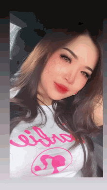 a woman wearing a white t-shirt with the word libra on it