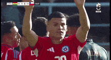 a soccer player wearing a red jersey with the number 30 on it