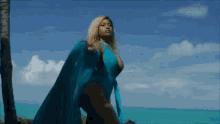 blue swimsuit swimsuit with robe ocean view strutting bed music video