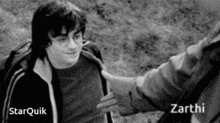 a black and white photo of harry potter shaking hands with a person named zarthi