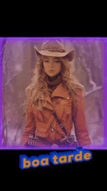 a woman in a cowboy hat is standing in front of the word boa tarde