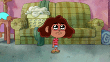 a cartoon girl is standing in front of a couch