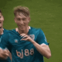 a soccer player wearing a jersey that says bj88