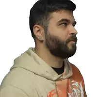 a man with a beard is wearing a hoodie with a dragon on the front