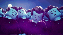 a group of lego figures are standing in a row with their heads down