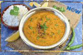 a bowl of dal and rice on a table