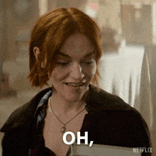a woman with red hair and a necklace says " oh " in white letters
