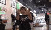 a man wearing a black shirt that says arizona on it