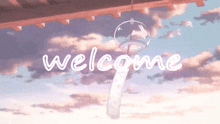 a wind chime with the word welcome written on it .