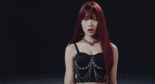 four women with red hair are lined up in a row